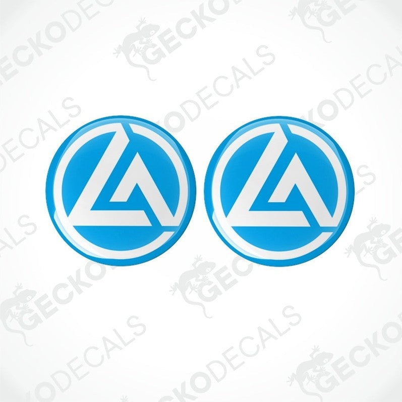 Two blue vinyl stickers with a white crescent moon design, placed on a white background.