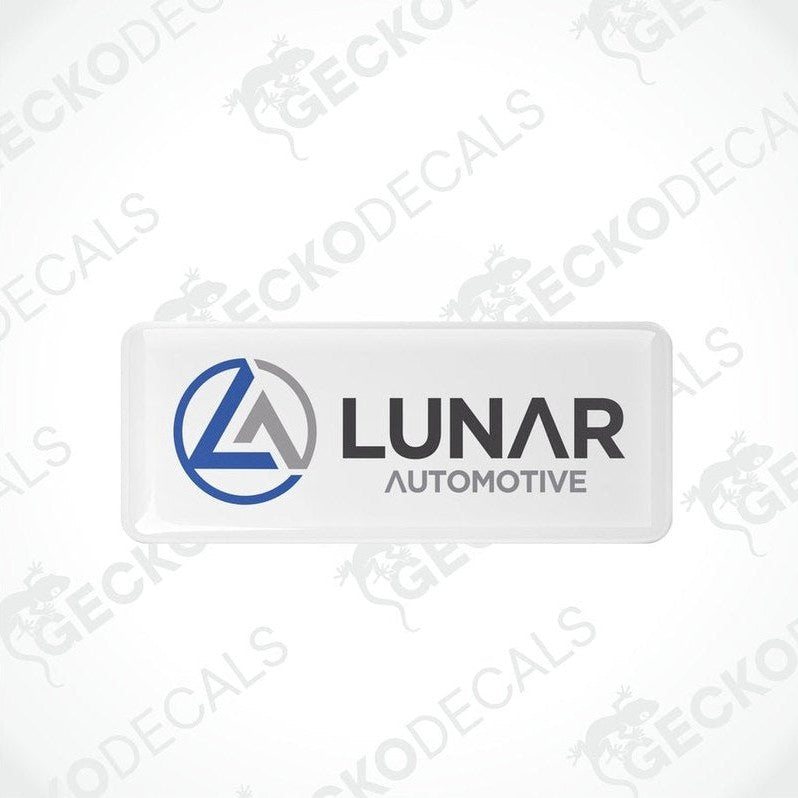 Two white vinyl stickers with a blue and grey Lunar Automotive logo, placed on a white background.