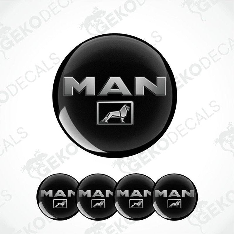 Set of four black round vehicle decals with the 'MAN' brand logo in white text.