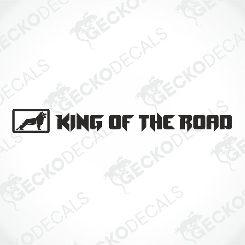 A die cut decal with the text 'KING OF THE ROAD' displayed on the windshield of a gray truck, illustrating the product's use.