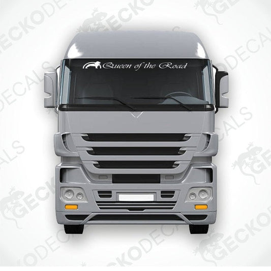 A die cut decal with the phrase 'Queen of the Road' positioned on the windshield of a gray truck.