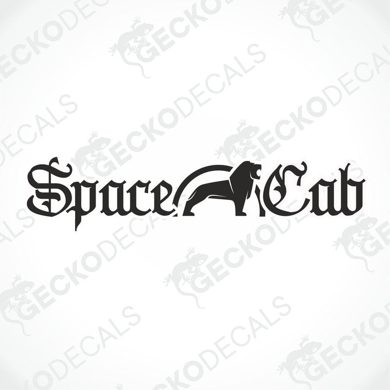 A die cut decal with the text 'Space Cab' on it, positioned on the front windscreen of a gray truck.