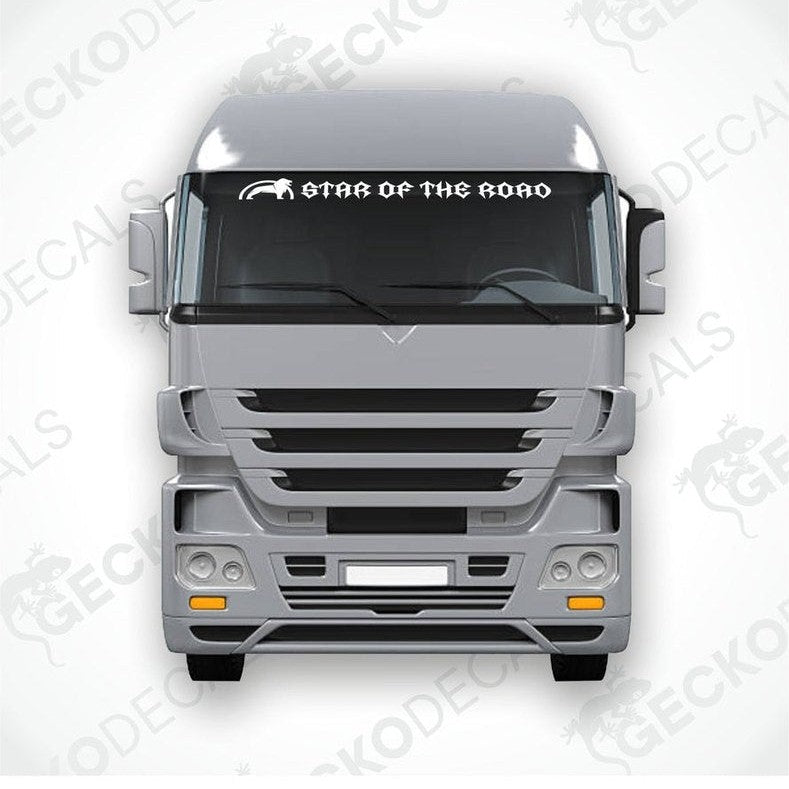 A die cut decal with the text 'STAR OF THE ROAD' displayed on the windshield of a gray truck.