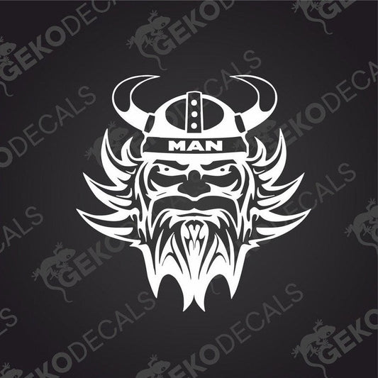 A die cut decal of a Viking helmet with the word 'MAN' on it, presented on a dark background.
