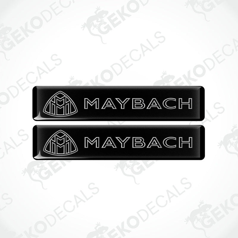 Two rectangular black vinyl decals with the Maybach logo printed in white.