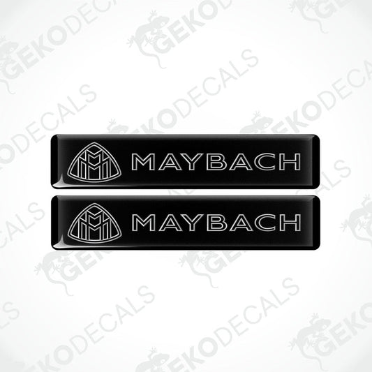 Two rectangular black vinyl decals with the Maybach logo printed in white.