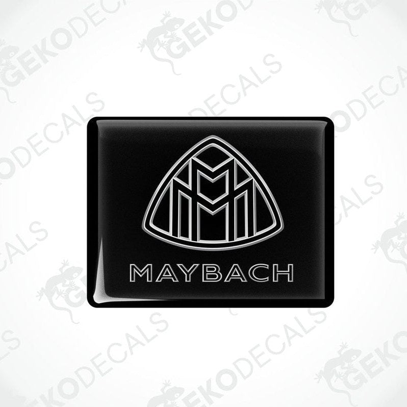 Black vinyl stickers with a white geometric design representing the Maybach brand logo.
