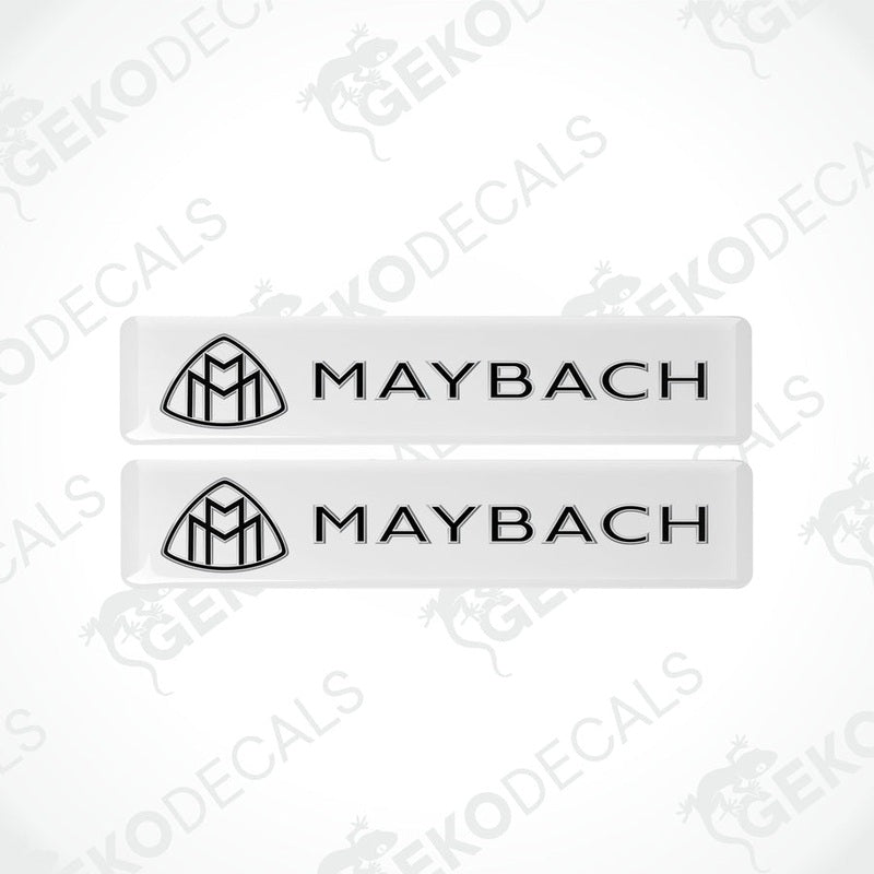 Two rectangular white vinyl decals with the Maybach logo printed in black.