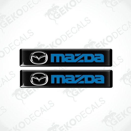 Two black and blue vinyl decals with the Mazda logo