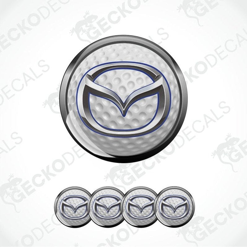 Mazda logo on a golf ball with additional logos below on a white background.