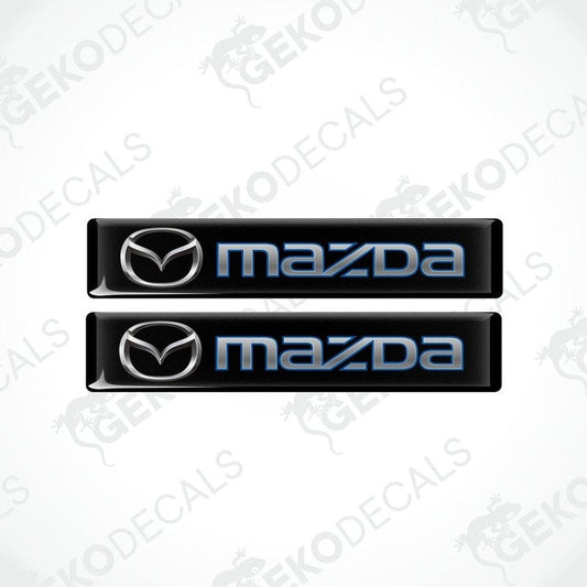 Two black and blue vinyl decals with the Mazda logo