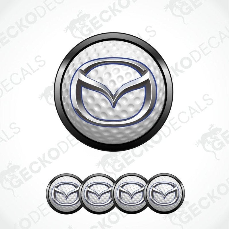 Mazda logo on a golf ball with additional logos below on a white background.