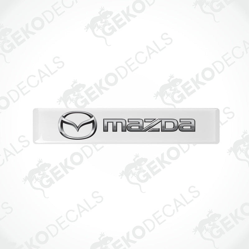 White vinyl stickers with the Mazda logo in the center.