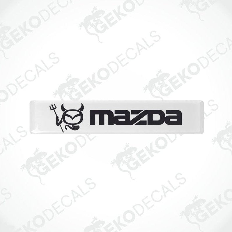  White and black vinyl decals with the Mazda logo.