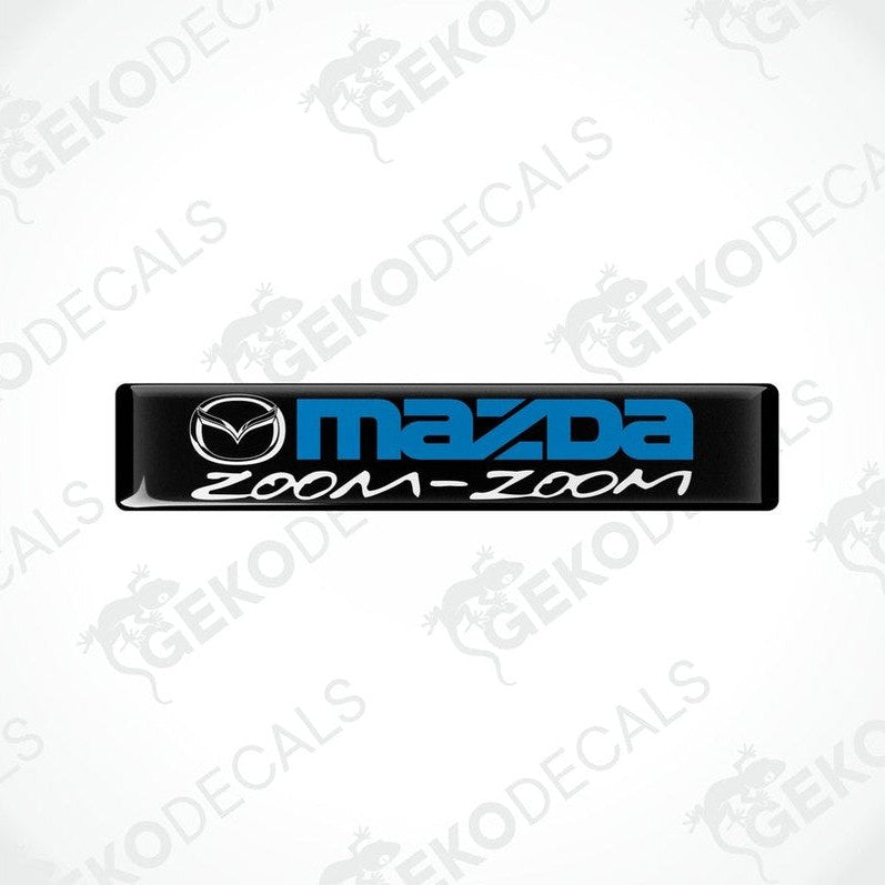 Black vinyl stickers with the text 'MAZDA ZOOM-ZOOM' in blue.