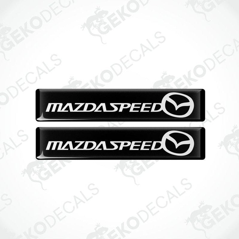 Two black vinyl stickers with the MazdaSpeed logo in white.