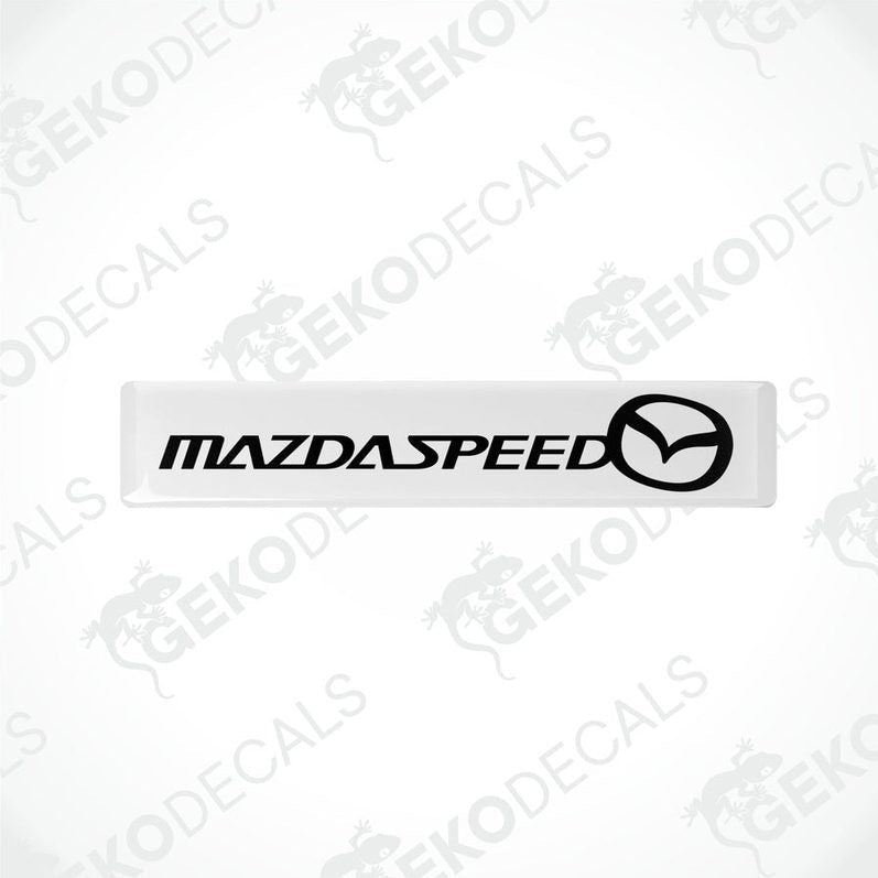 White vinyl stickers with the MazdaSpeed logo in black.