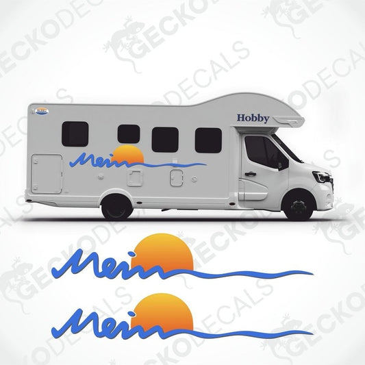 A white caravan with 'MEIN HOBBY' and a graphic decal featuring a sun and waves design on the side.