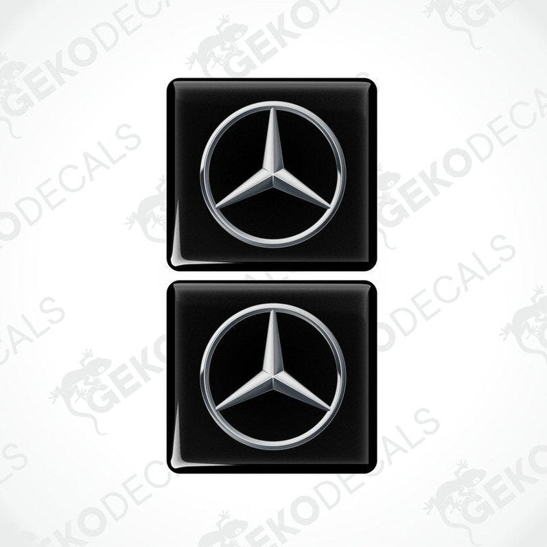Two black vinyl stickers with a Mercedes-Benz logo on a white background.