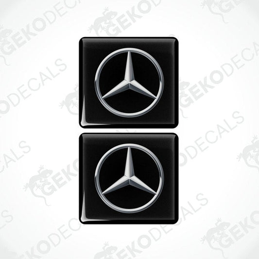 Two black vinyl stickers with a Mercedes-Benz logo on a white background.
