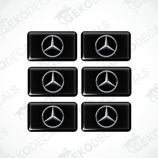 A set of six black vinyl stickers with a Mercedes-Benz logo on each.