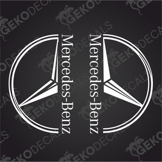 Two black and white decals of the Mercedes-Benz logo, one for the front left and one for the front right, on a dark background.