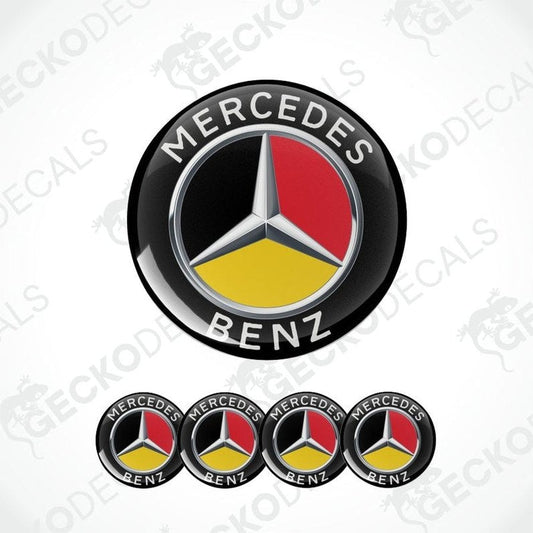 A three-dimensional Mercedes-Benz logo with the colors of the German flag as a background. Mercedes Benz written on top and bottom