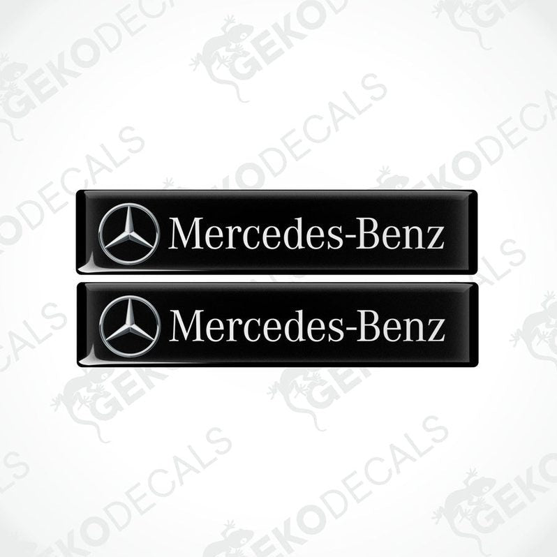 Two black decals with the Mercedes-Benz logo