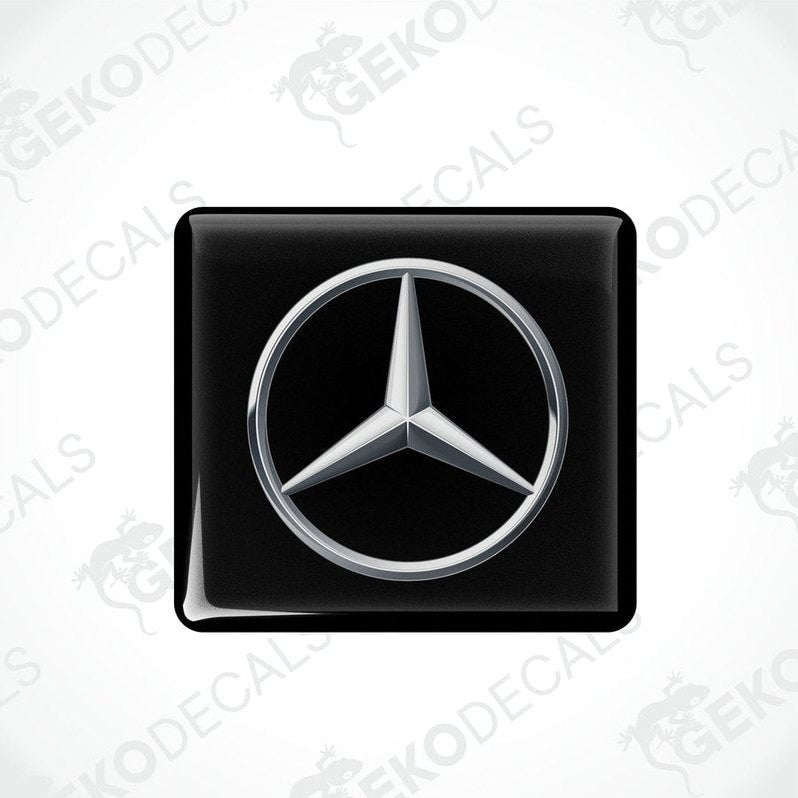 Single Mercedes-Benz silver domed epoxy car sticker on black