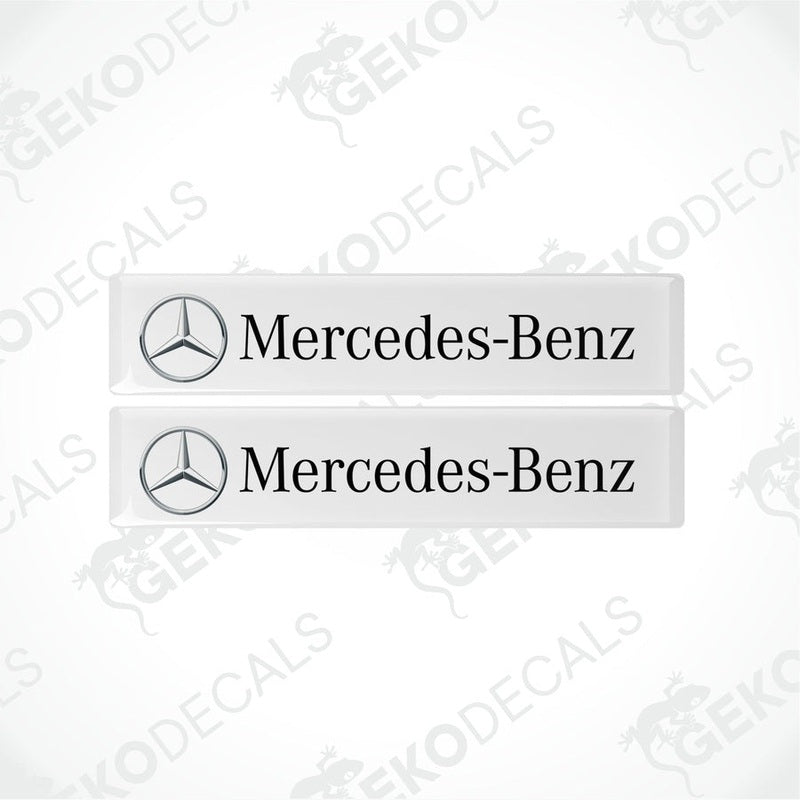 Two white decals with the Mercedes-Benz logo