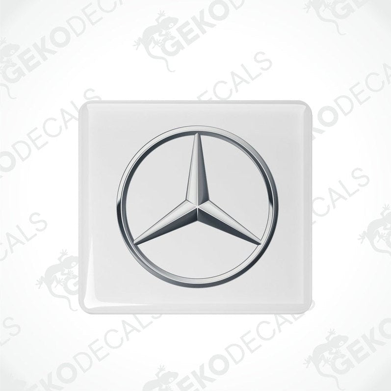  White vinyl stickers with a Mercedes-Benz logo on a white background.