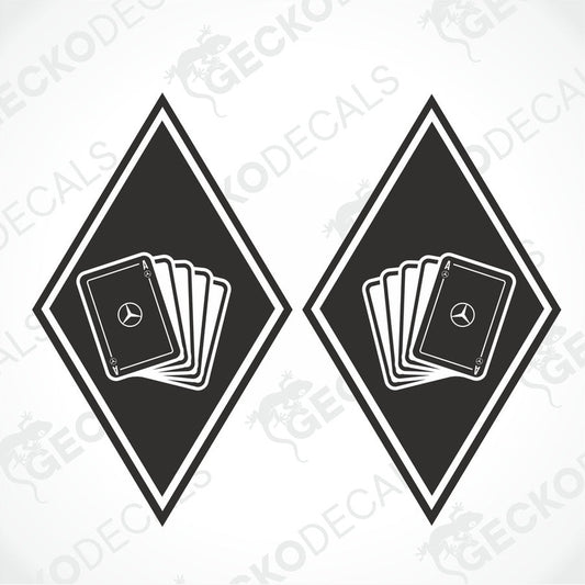 Two black decals with a diamond and a stack of cards design, with the Mercedes-Benz logo on the top of the cards.