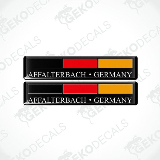 Two rectangular car decals with a black, red, and yellow design, text stating 'AFFALTERBACH • GERMANY'.