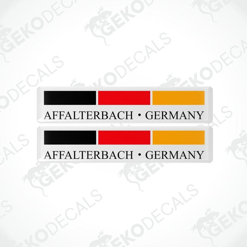 Two rectangular car decals with a black, red, and yellow design, text stating 'AFFALTERBACH • GERMANY'.