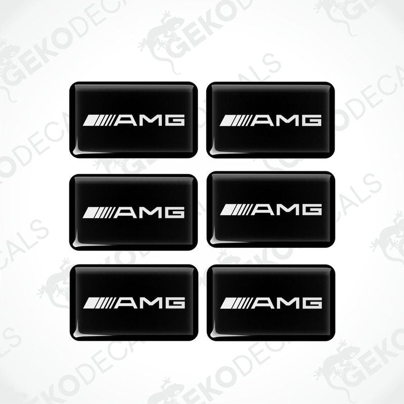 A set of six black rectangular car decals with the 'AMG' logo in white.