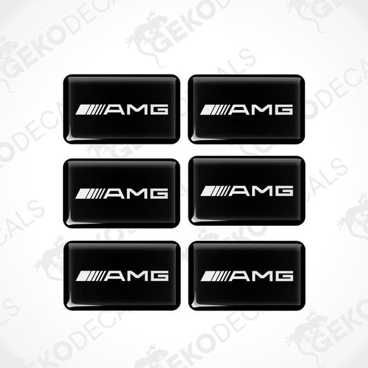 A set of six black rectangular car decals with the 'AMG' logo in white.