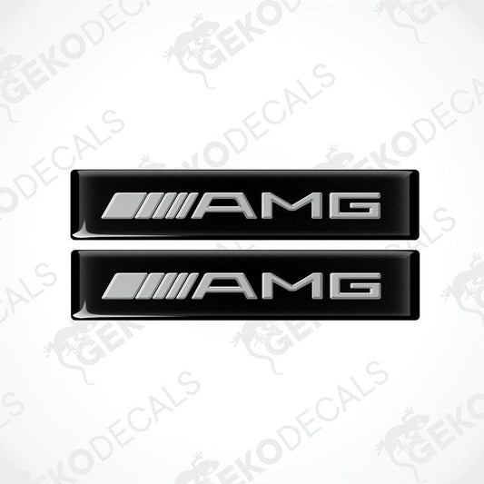 Two black vinyl stickers with the Mercedes-Benz AMG logo on a white background.