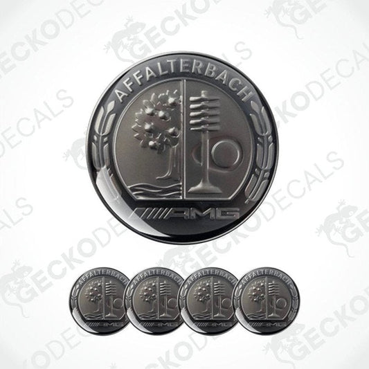 Set of metallic emblem stickers with 'AMG' branding on a white background.
