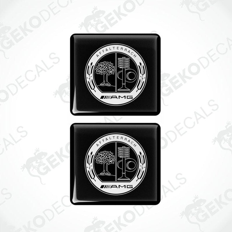Two black vinyl stickers with a white and silver Mercedes-Benz AMG Affalterbach logo design.