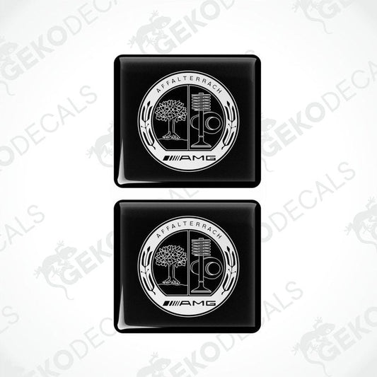 Two black vinyl stickers with a white and silver Mercedes-Benz AMG Affalterbach logo design.