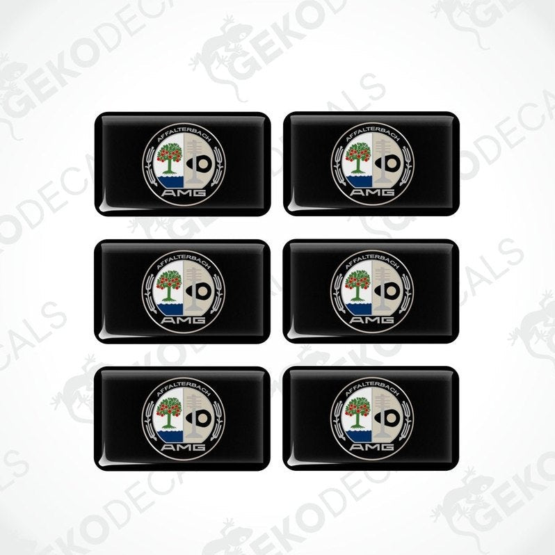 A set of six black rectangular car decals with a white and green logo on them.