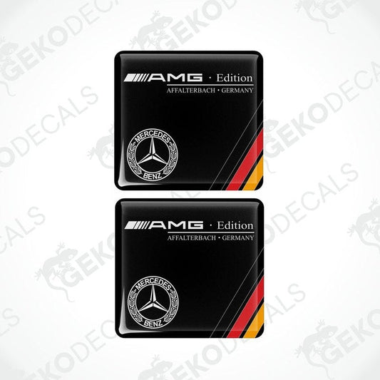Two black Mercedes-Benz AMG Edition car decals with red and yellow stripes and the Mercedes-Benz logo.