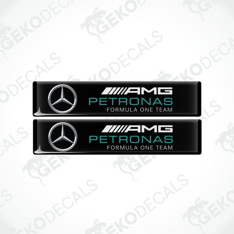 Two vinyl decals with a polyurethane coating featuring the AMG PETRONAS Formula One Team logo in black, silver, and green colors.