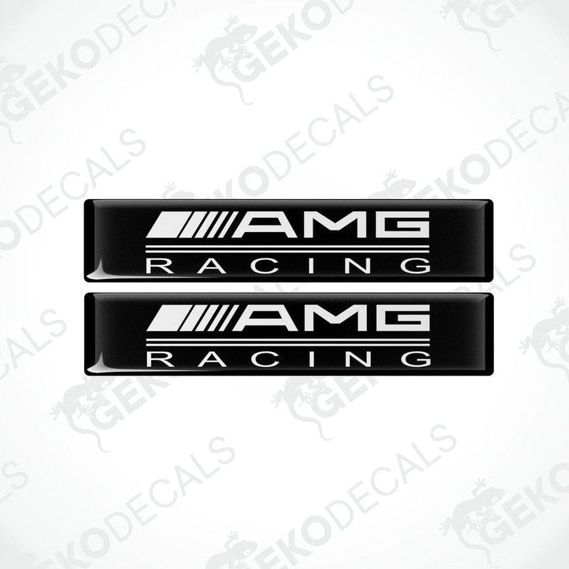 Two black vinyl stickers with the text 'AMG RACING' in white, placed against a white background.