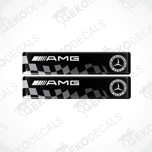 Two black Mercedes-Benz AMG racing decals with white and silver brand logos.