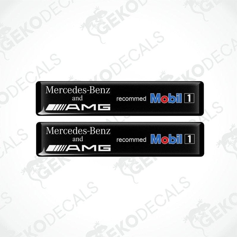 Two black vinyl decals with white and silver text reading 'Mercedes-Benz and AMG recommended Mobil1', against a white background.
