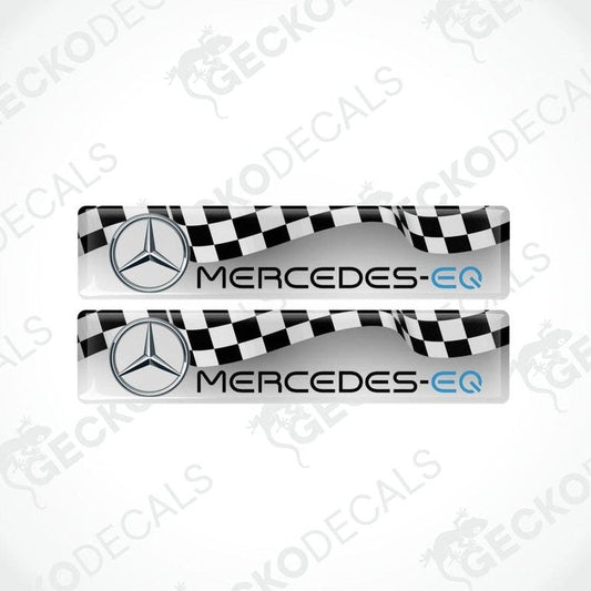 Two Mercedes-EQ car decals with checkered pattern on a white background