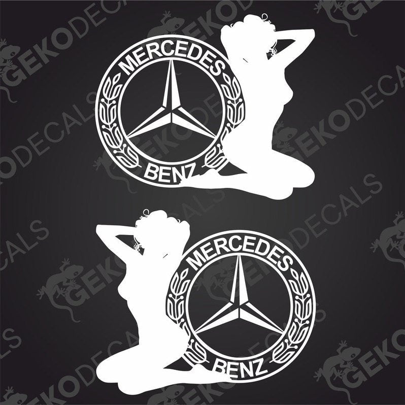 A pair of white decals featuring a female figure with the Mercedes-Benz logo, designed for use on vehicles.