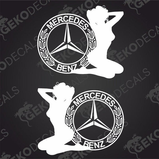 A pair of white decals featuring a female figure with the Mercedes-Benz logo, designed for use on vehicles.