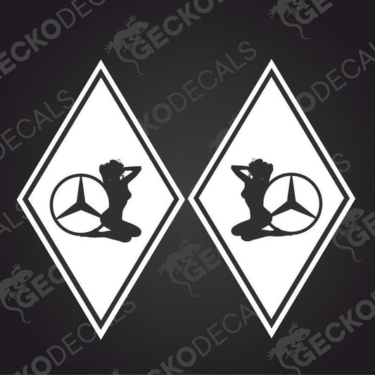 A set of two black and white die cut stickers with a mercedes-benz girl diamond design, delivered on transfer paper.
